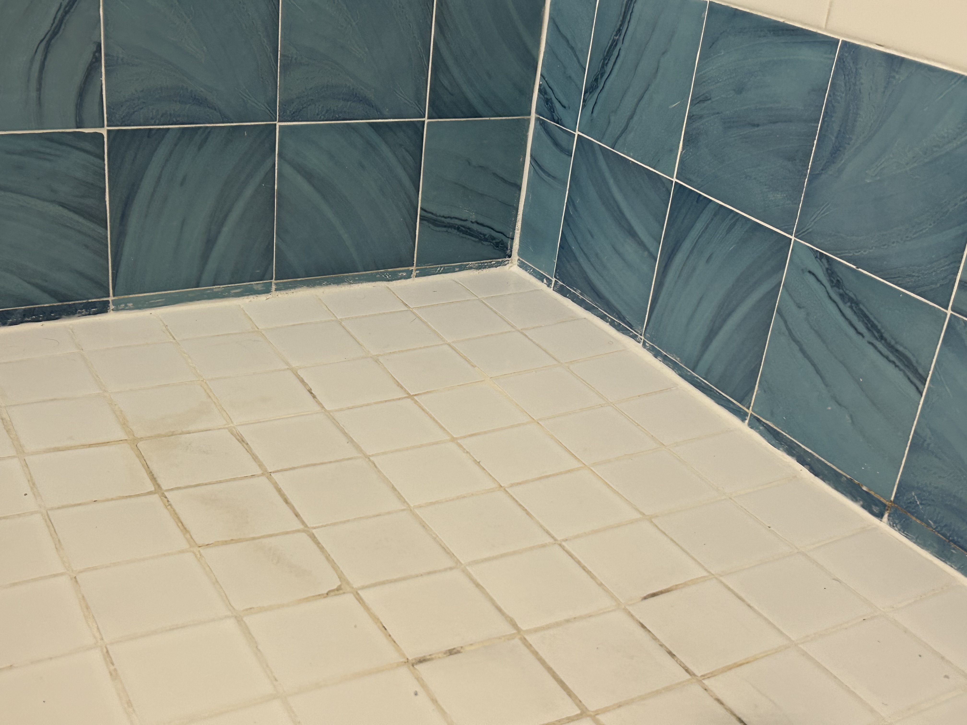 Caulking around shower pan