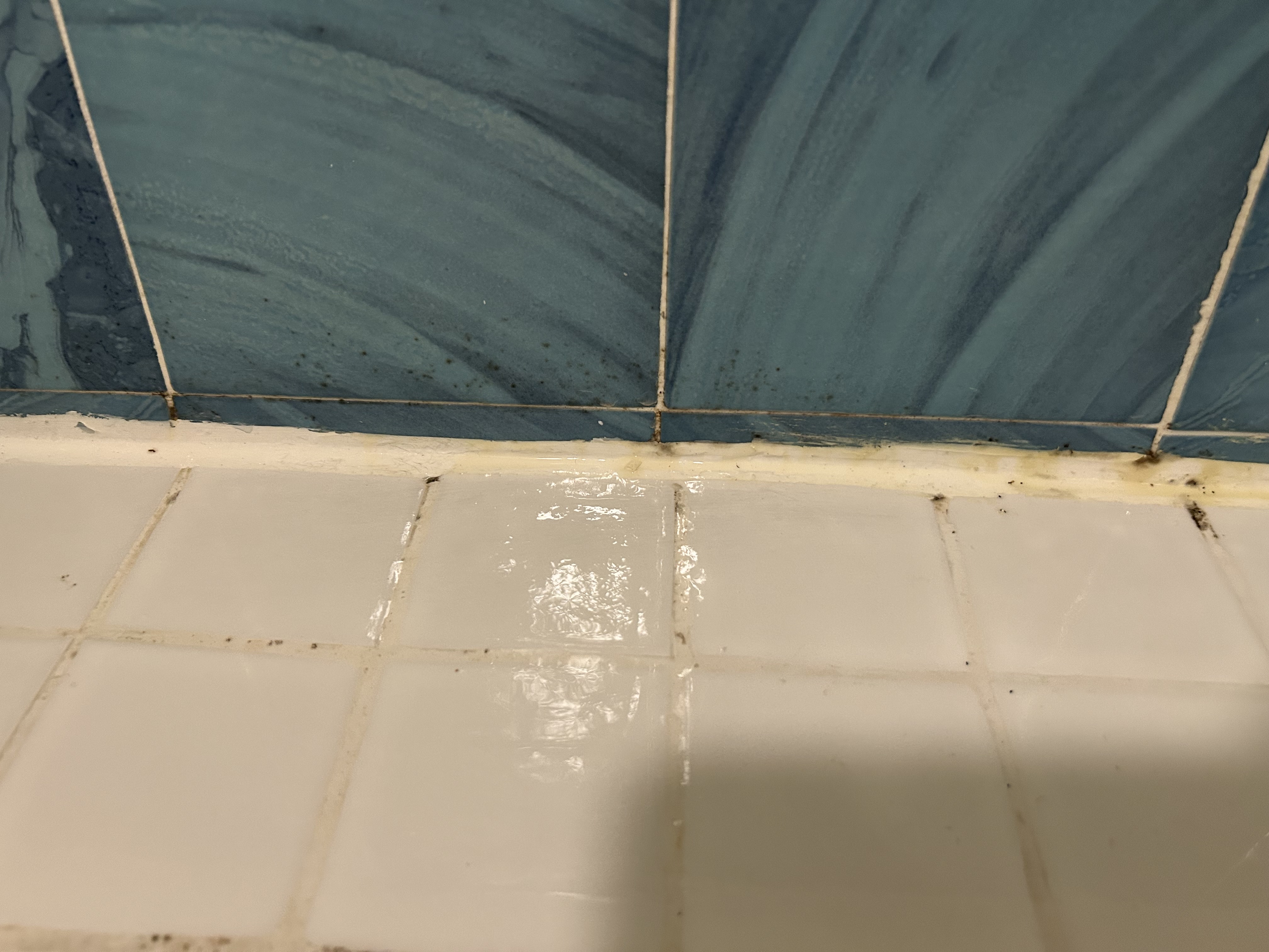Caulking around shower pan
