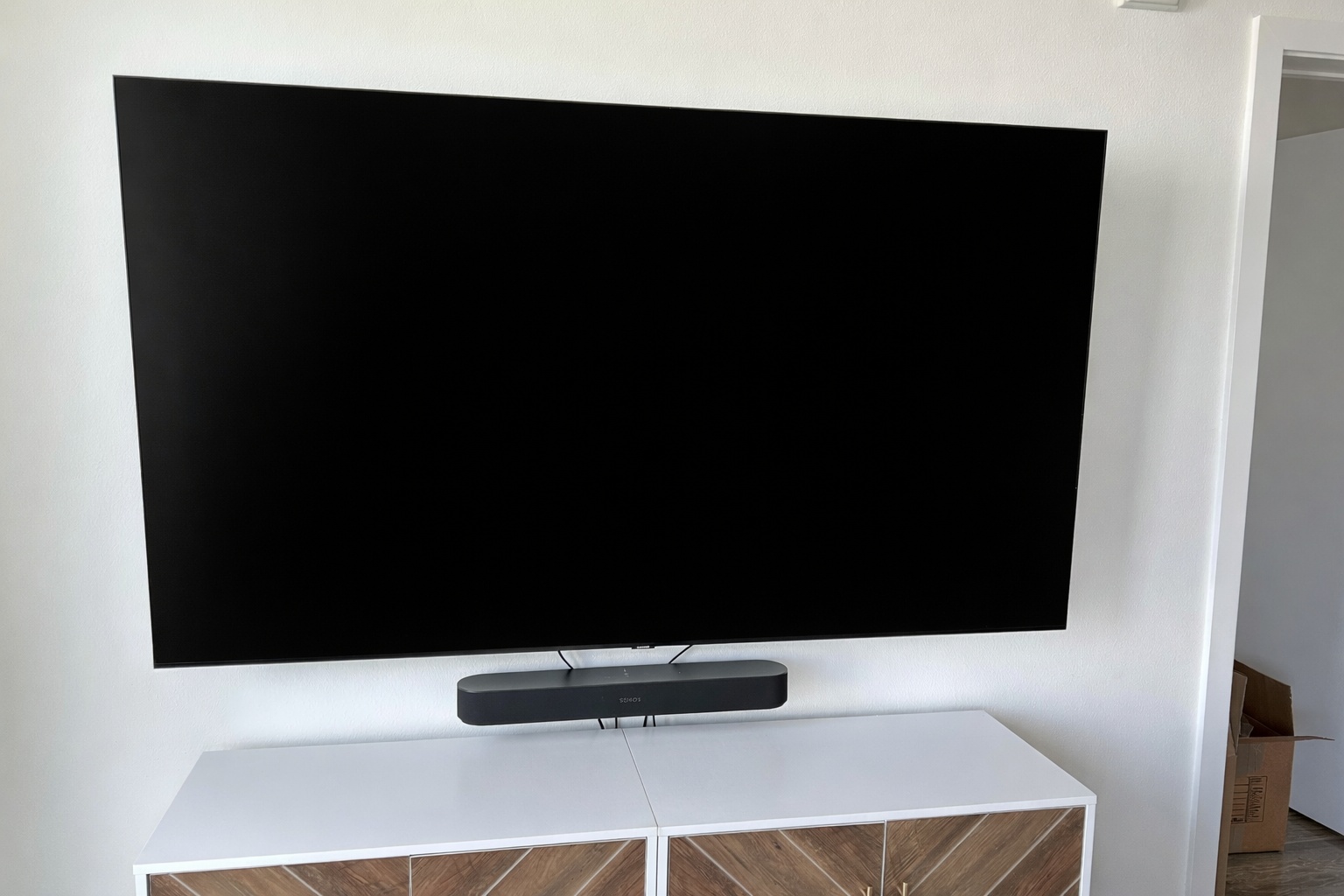 Living Room TV mounted on wall with soundbar