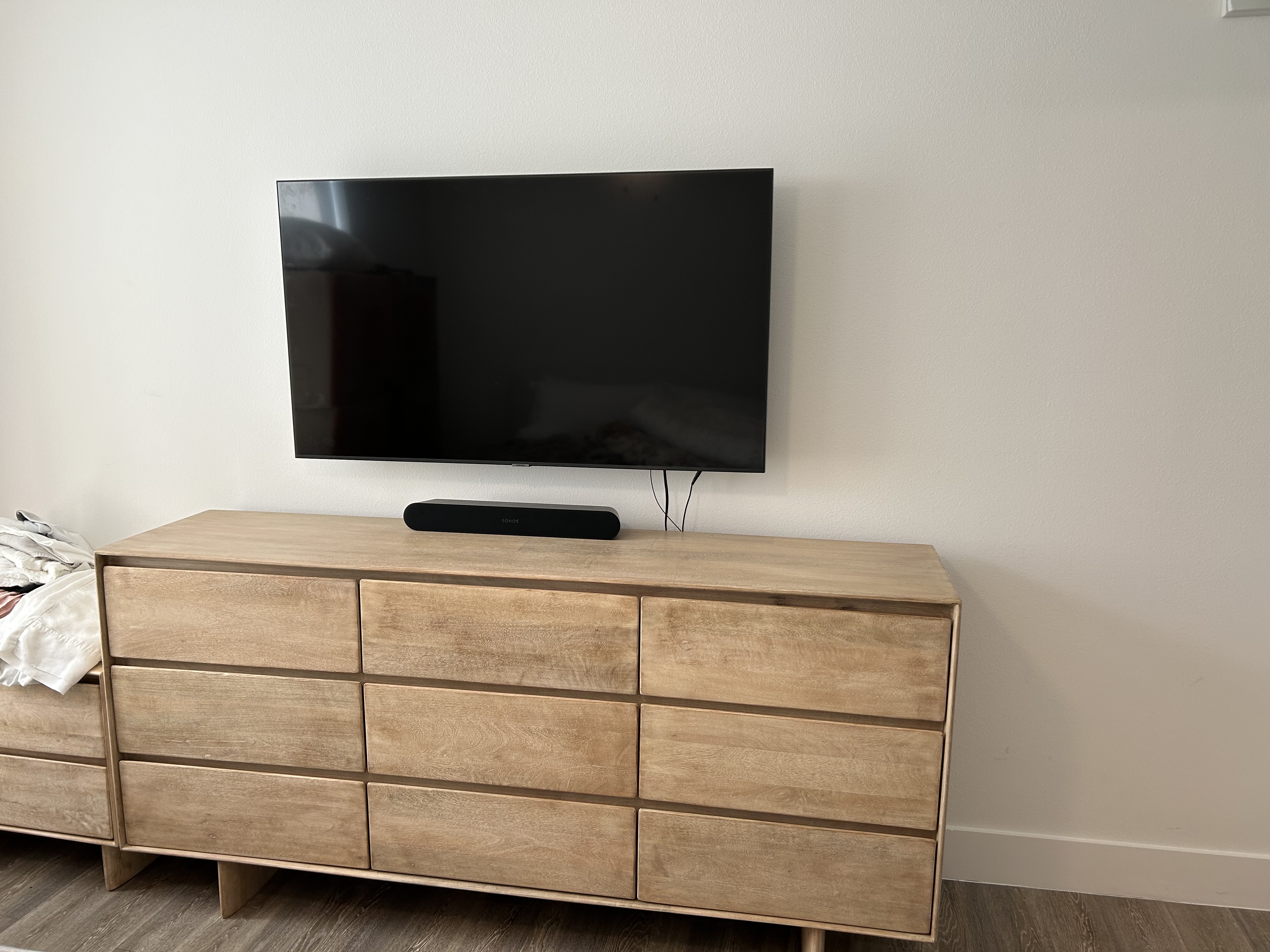 Bedroom TV mounted on wall