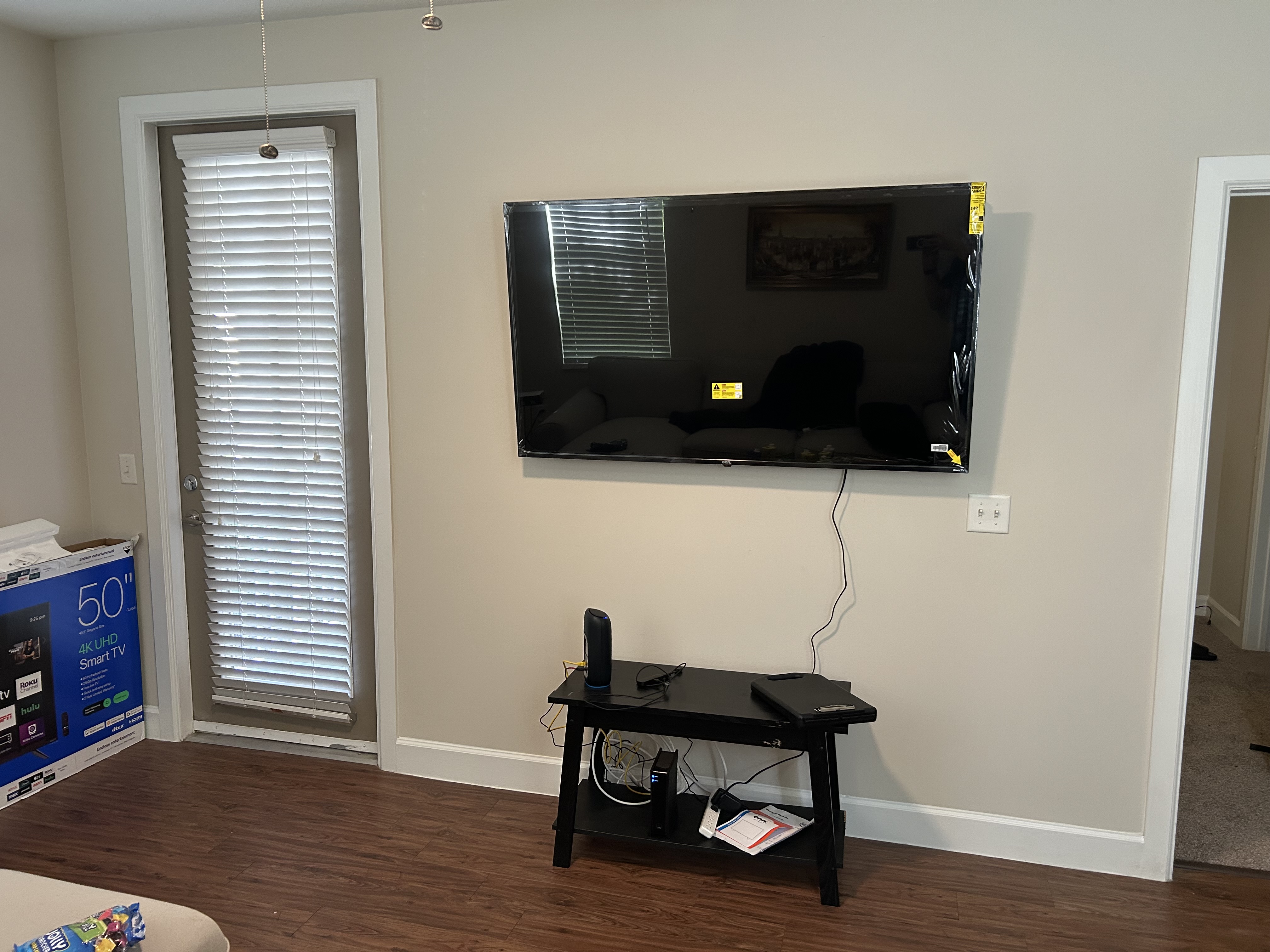 Living room TV mounted on wall